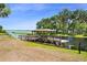 Picturesque dock nestled by the water's edge offers a serene spot to unwind and enjoy the natural surroundings at 2680 Nottel Dr, St Cloud, FL 34772
