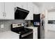 Close up view of the kitchen with stainless steel appliances and white cabinetry at 2680 Nottel Dr, St Cloud, FL 34772