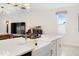 Close up of the large white kitchen island with stainless steel faucet and farmhouse sink at 2680 Nottel Dr, St Cloud, FL 34772