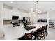 Kitchen with stainless steel appliances, white cabinetry and large kitchen island with seating at 2680 Nottel Dr, St Cloud, FL 34772