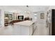 Bright, open kitchen flows into the living room, featuring an expansive island with views of the backyard at 2680 Nottel Dr, St Cloud, FL 34772