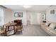 Living room with sofa, chairs, table, and art at 2680 Nottel Dr, St Cloud, FL 34772