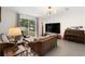 Living room with large windows, comfortable seating and neutral decor at 2680 Nottel Dr, St Cloud, FL 34772