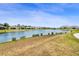 Wide angle of the expansive community pond, showcasing waterfront homes and a picturesque setting at 2680 Nottel Dr, St Cloud, FL 34772