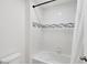 A close-up of the shower showcases the modern white tile and the stylish horizontal accent tiles at 2680 Nottel Dr, St Cloud, FL 34772