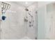 Modern marble shower with glass door and chrome fixtures at 2680 Nottel Dr, St Cloud, FL 34772