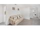 Cozy sitting area with a comfortable couch and decorative pillows, perfect for relaxing and enjoying the light at 2680 Nottel Dr, St Cloud, FL 34772