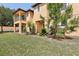 Charming backyard featuring a lush lawn with mature trees and privacy at 2718 Bushman Dr, Kissimmee, FL 34746