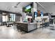 Bar area featuring a counter with barstools, televisions, and a game area at 2718 Bushman Dr, Kissimmee, FL 34746