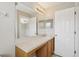 Bathroom features vanity with a mirror and neutral walls at 2718 Bushman Dr, Kissimmee, FL 34746