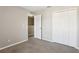 Bedroom features carpeted floors, neutral walls, closet, and an open doorway at 2718 Bushman Dr, Kissimmee, FL 34746