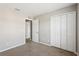 Bedroom featuring neutral carpet, paint, and closets at 2718 Bushman Dr, Kissimmee, FL 34746
