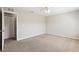 Bedroom features carpeted floors, neutral walls, ceiling fan, and closet with bi-fold doors at 2718 Bushman Dr, Kissimmee, FL 34746