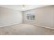 Bright bedroom featuring neutral walls, plush carpet, ceiling fan, and a window offering natural light at 2718 Bushman Dr, Kissimmee, FL 34746