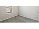 Bedroom featuring neutral paint, a window with blinds, and neutral carpeting at 2718 Bushman Dr, Kissimmee, FL 34746