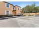 Exterior view of condo building and parking lot on sunny day at 2718 Bushman Dr, Kissimmee, FL 34746