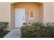 Close up of white front door with decorative window accent at 2718 Bushman Dr, Kissimmee, FL 34746