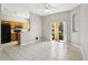 Bright living room with tile flooring, ceiling fan, and access to outdoor patio at 2718 Bushman Dr, Kissimmee, FL 34746