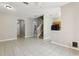 Open living area with staircase, tile floors, and access to kitchen at 2718 Bushman Dr, Kissimmee, FL 34746