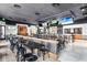 Zac's Sports Bar and Grill offering bar top and table seating with multiple televisions at 2718 Bushman Dr, Kissimmee, FL 34746