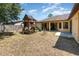 A spacious backyard features a playset, patio, and lush green grass. Great for outdoor activities at 2739 Village Pine Ter, Orlando, FL 32833