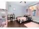Charming bedroom with cozy pink decor, decorative accents, and ample natural light at 2739 Village Pine Ter, Orlando, FL 32833