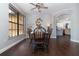 Dining room with a dining table set with chairs and a view of the kitchen at 2739 Village Pine Ter, Orlando, FL 32833