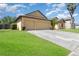 Charming single-Gathering home featuring an attached two-car garage and well-maintained lawn at 2739 Village Pine Ter, Orlando, FL 32833