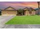 Charming single-Gathering home featuring an attached two-car garage and a well-manicured lawn at 2739 Village Pine Ter, Orlando, FL 32833