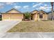 Charming one story home with a three car garage and well manicured lawn with beautiful landscaping at 2739 Village Pine Ter, Orlando, FL 32833