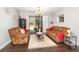 Comfortable living room featuring stylish furnishings, neutral paint, and sliding glass doors at 2739 Village Pine Ter, Orlando, FL 32833