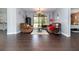 Bright living room with cozy furniture, tile floors and view of backyard at 2739 Village Pine Ter, Orlando, FL 32833