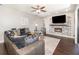 Comfortable living room with tile floors, fireplace, and modern decor at 2739 Village Pine Ter, Orlando, FL 32833