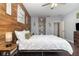 Spacious main bedroom featuring a wood accent wall and ensuite bathroom access at 2739 Village Pine Ter, Orlando, FL 32833