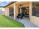 Covered patio with comfortable seating, offering a relaxing outdoor space with view of backyard at 2739 Village Pine Ter, Orlando, FL 32833