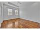 Spacious bedroom featuring hardwood floors, white trim, ceiling fan, and natural light at 312 Grand Bay Ln, Celebration, FL 34747