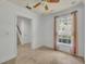 Well-lit bedroom features a ceiling fan, natural light, and tile flooring at 312 Grand Bay Ln, Celebration, FL 34747