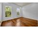 Bright bedroom featuring hardwood floors and two large windows with natural light at 312 Grand Bay Ln, Celebration, FL 34747