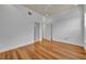 Bright bedroom featuring hardwood floors, white trim, ceiling fan, and two doorways at 312 Grand Bay Ln, Celebration, FL 34747