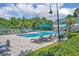 Inviting community pool features lounge chairs and umbrellas for relaxing by the water at 312 Grand Bay Ln, Celebration, FL 34747