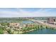 A scenic aerial view highlights the property's waterfront location, nestled among lush greenery, with the city skyline in the distance at 320 Lakeview St # 222, Orlando, FL 32804