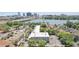 A panoramic view of the property, showcasing the building's position near the tranquil lake and the city skyline at 320 Lakeview St # 222, Orlando, FL 32804