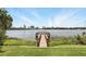 Lakeside tranquility from the property's pier offers serene water views and a glimpse of the distant cityscape at 320 Lakeview St # 222, Orlando, FL 32804