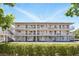 Exterior showcasing modern building design with multiple balconies and outdoor living spaces, surrounded by beautiful landscaping at 320 Lakeview St # 222, Orlando, FL 32804