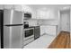 Modern kitchen featuring stainless steel appliances, white cabinets, and granite countertops at 320 Lakeview St # 222, Orlando, FL 32804