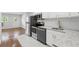 Modern kitchen featuring stainless steel appliances, white cabinets, and granite countertops at 320 Lakeview St # 222, Orlando, FL 32804
