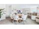 Bright dining area adjacent to the living room featuring a round table, chairs, and decorative accents at 3206 Partington Blvd, Davenport, FL 33837