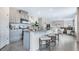 Contemporary kitchen featuring granite countertops, stainless steel appliances, and island with seating area at 3206 Partington Blvd, Davenport, FL 33837
