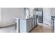 Kitchen island with granite countertop, providing barstool seating and ample space for food preparation at 3206 Partington Blvd, Davenport, FL 33837