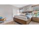 Serene primary bedroom with king bed, wood blinds, and relaxing decor for peaceful nights at 3206 Partington Blvd, Davenport, FL 33837